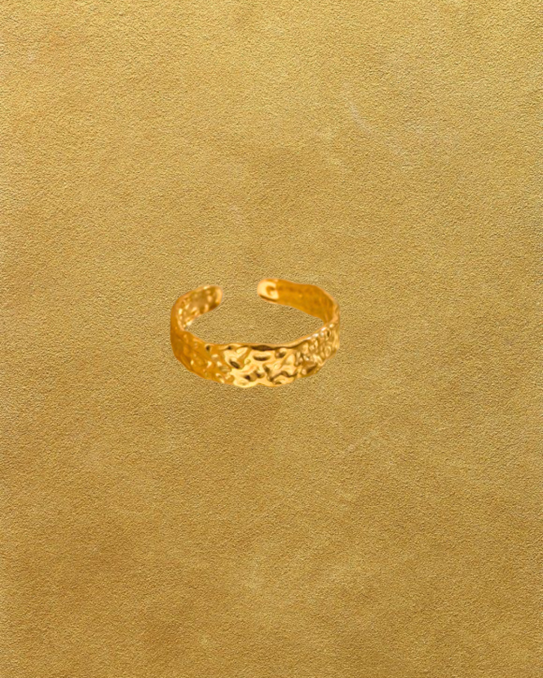 Gold textured ring on a gold textured background