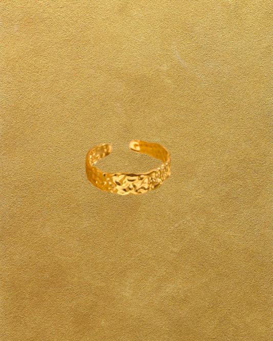 Gold textured ring on a gold textured background